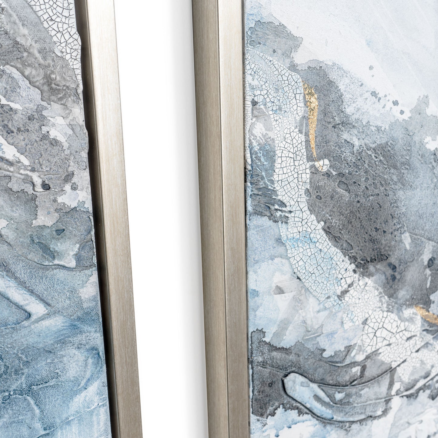 Close-up of textured silver floater frame with blue, white, and gray abstract artwork featuring gold leaf details.