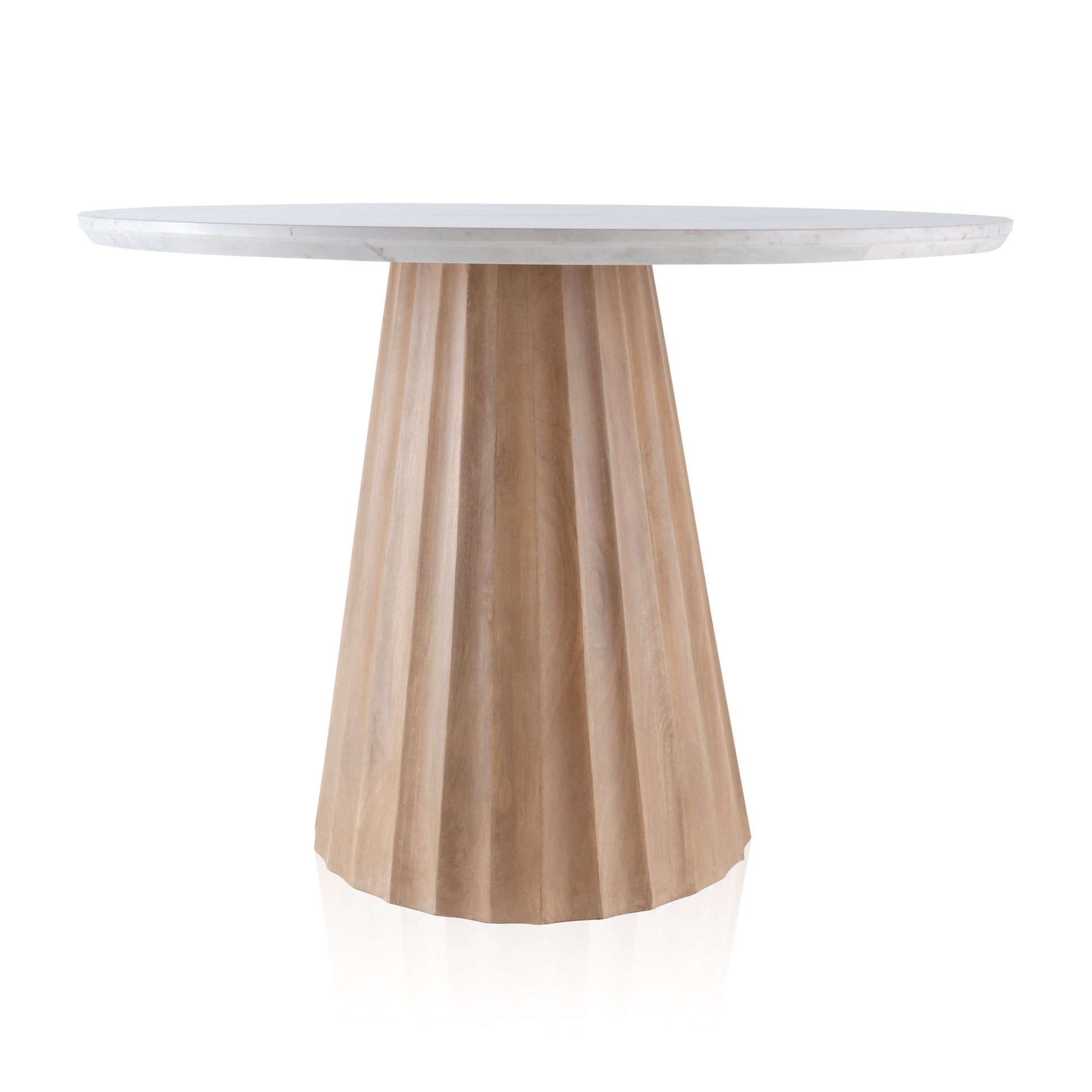 Round dining table with a white marble top and a natural fluted mango wood base.