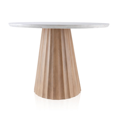 Round dining table with a white marble top and a natural fluted mango wood base.