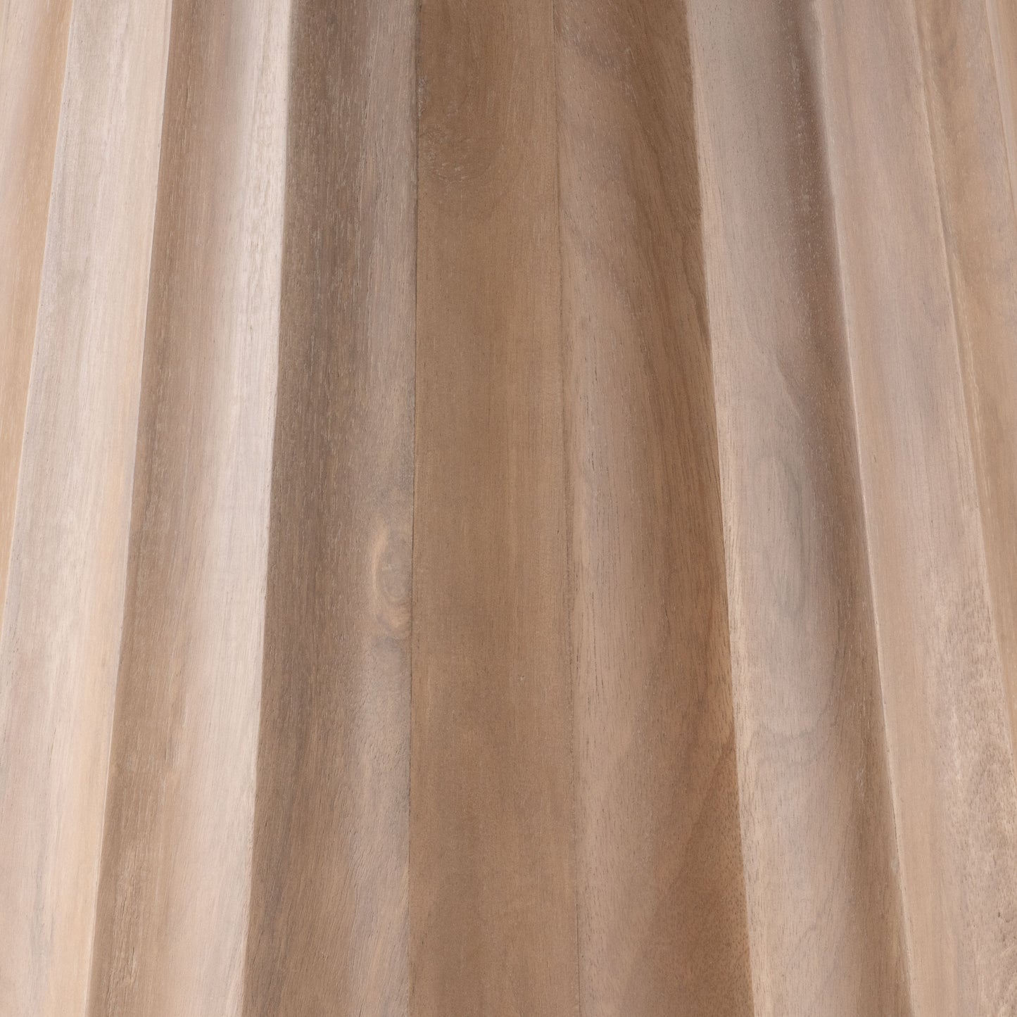 Close-up of the natural mango wood fluted base on the Nalani dining table.