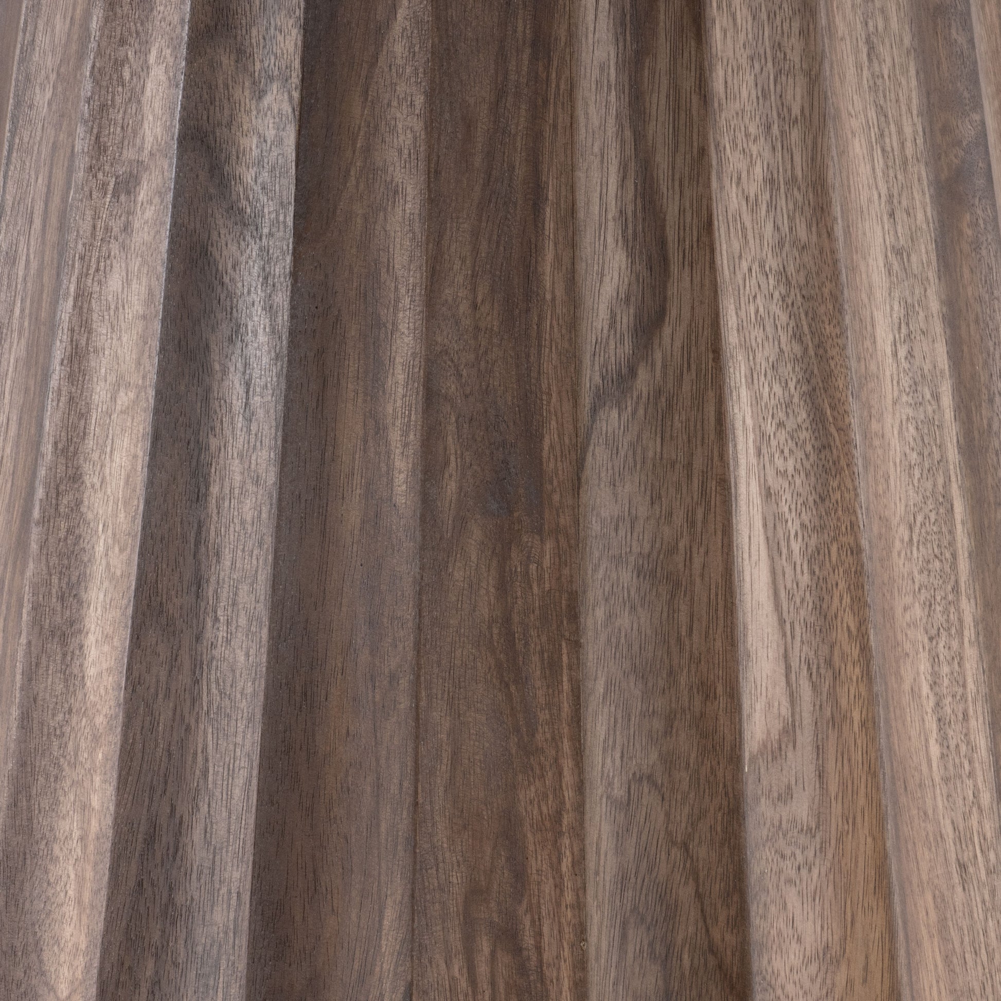 Close-up of the dark walnut fluted base on the Nalani dining table.