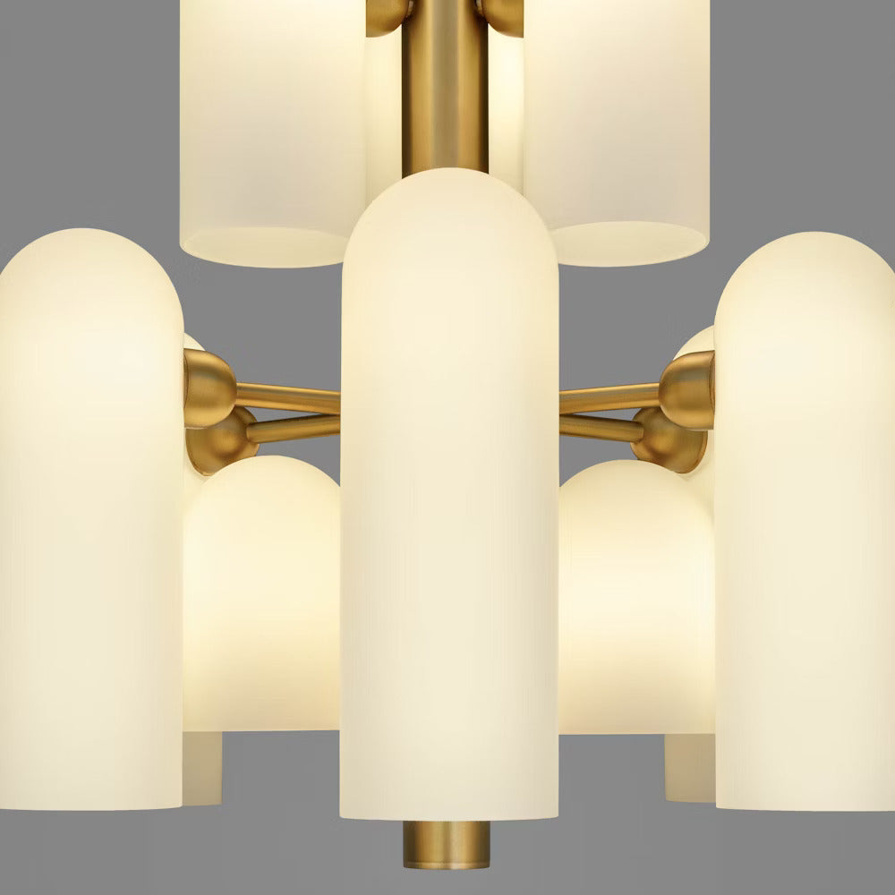 Close-up view of frosted opal glass shades with a lacquered burnished brass frame.