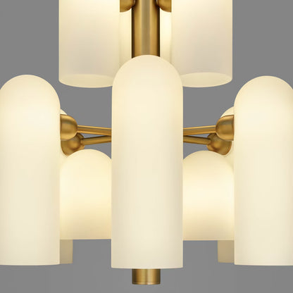 Close-up view of frosted opal glass shades with a lacquered burnished brass frame.