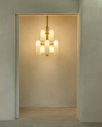 Warm illuminated glow of the Odyssey 12 Chandelier in a minimalist space.