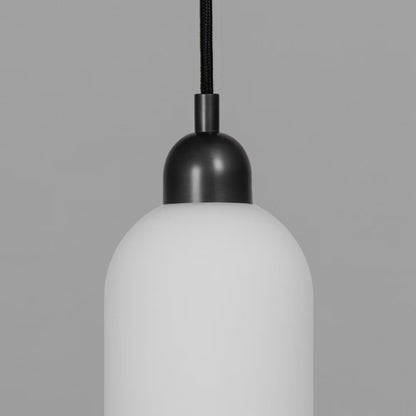 Odyssey Pendant Light in Black Gunmetal finish with opal glass shade turned off.