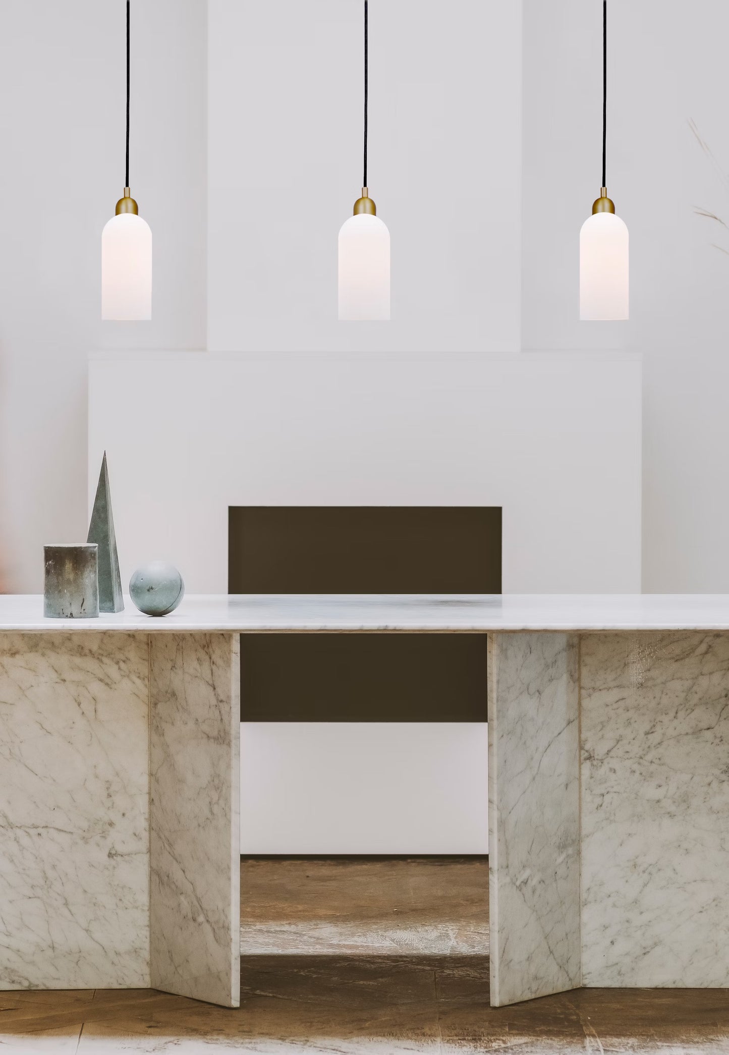 Multiple Odyssey Pendant Lights styled in a modern interior with marble and minimalist décor.