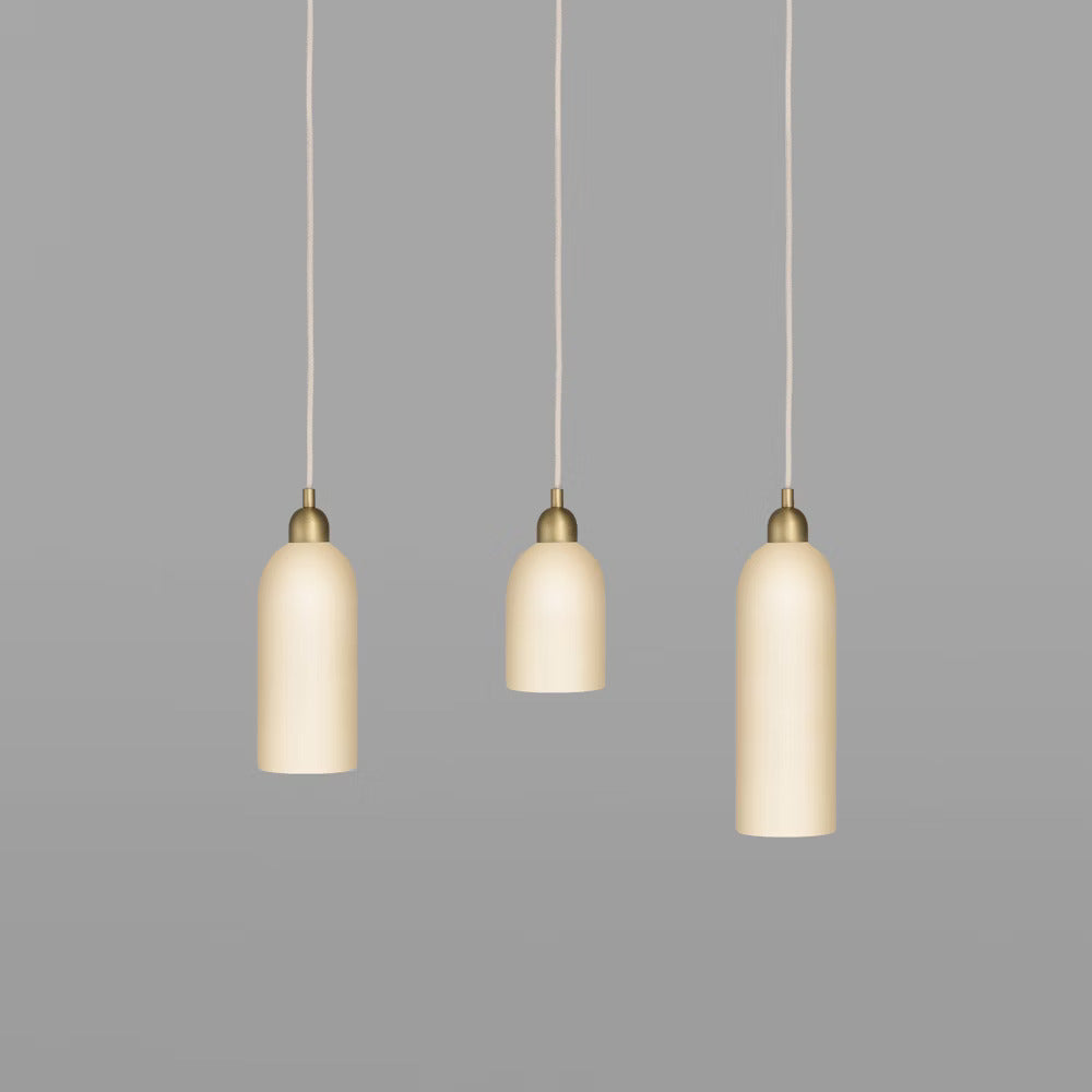 Close-up of Odyssey Pendant Lights glowing warmly in a clustered arrangement.