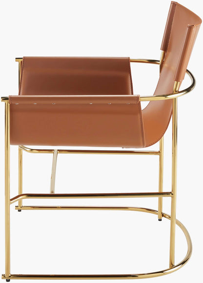 Profile view of the Surya Kara dining chair showcasing its ergonomic design and gold-plated frame.