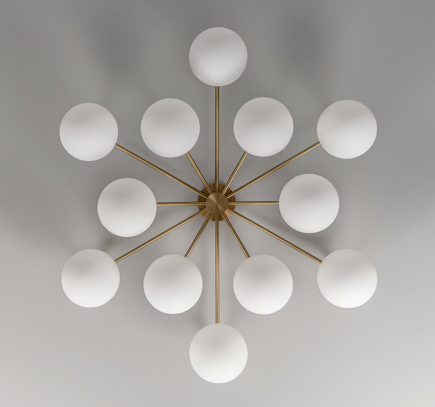 Orion Round Chandelier with Opal Matte Glass Globes in an unlit state.