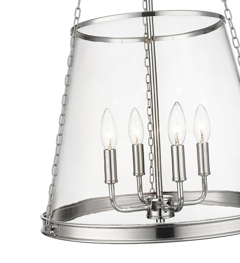 Close-up of polished nickel cone pendant showing clear glass shade and candle bulbs.