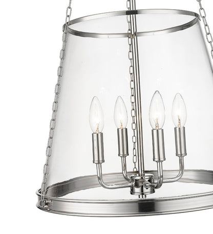 Close-up of polished nickel cone pendant showing clear glass shade and candle bulbs.