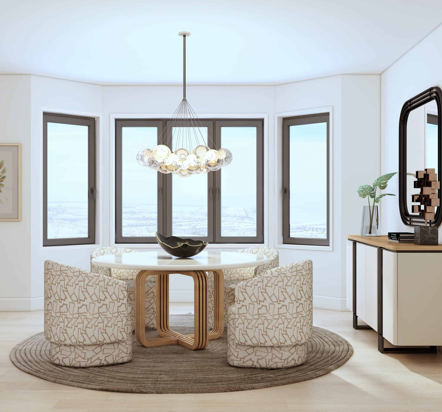 Stylish dining room with round contemporary dining table, wooden base, white top, and four patterned fabric chairs.