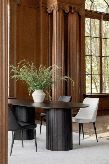 Elegant dining room featuring the Povera Black Dining Table with chairs and décor.