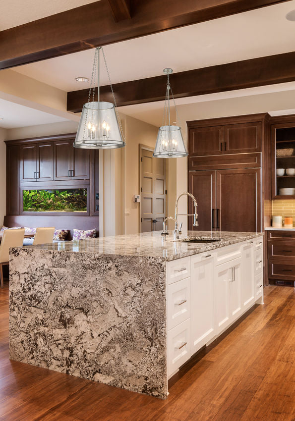 prescott pendant light brushed nickel above kitchen island.
