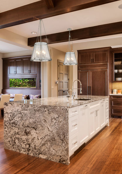 prescott pendant light brushed nickel above kitchen island.