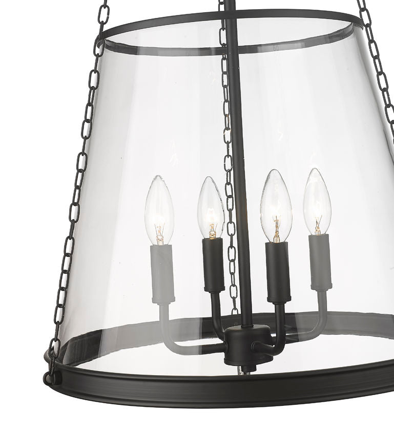 prescott pendant light in matte black with clear tapered glass shade and four candelabra bulbs.
