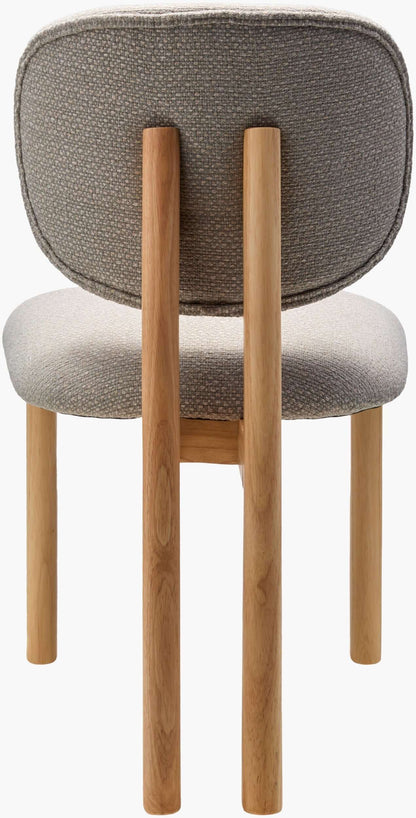  Back view of the Surya Rena Dining Chair, highlighting the natural wood finish and recycled fabric upholstery.