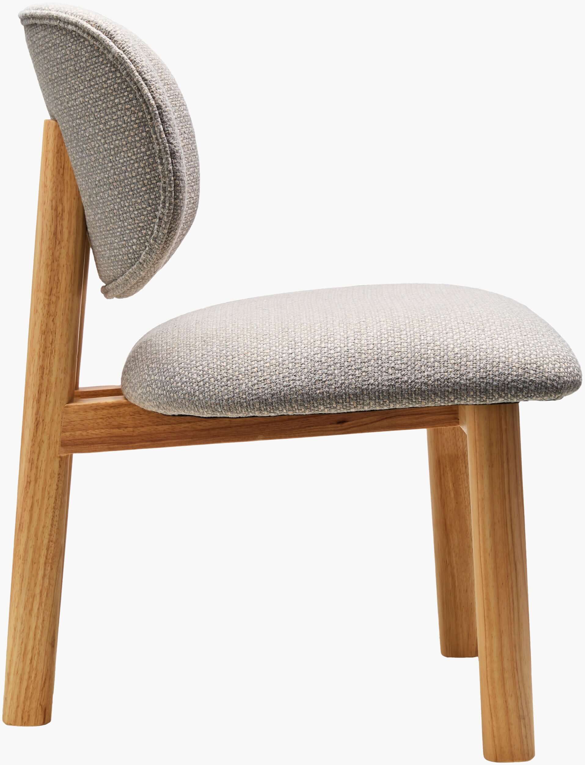 Side profile of the Surya Rena Dining Chair, displaying the sturdy rubber wood legs and plush upholstered seat.