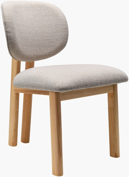 Side profile of the Surya Rena Dining Chair, displaying the sturdy rubber wood legs and plush upholstered seat.