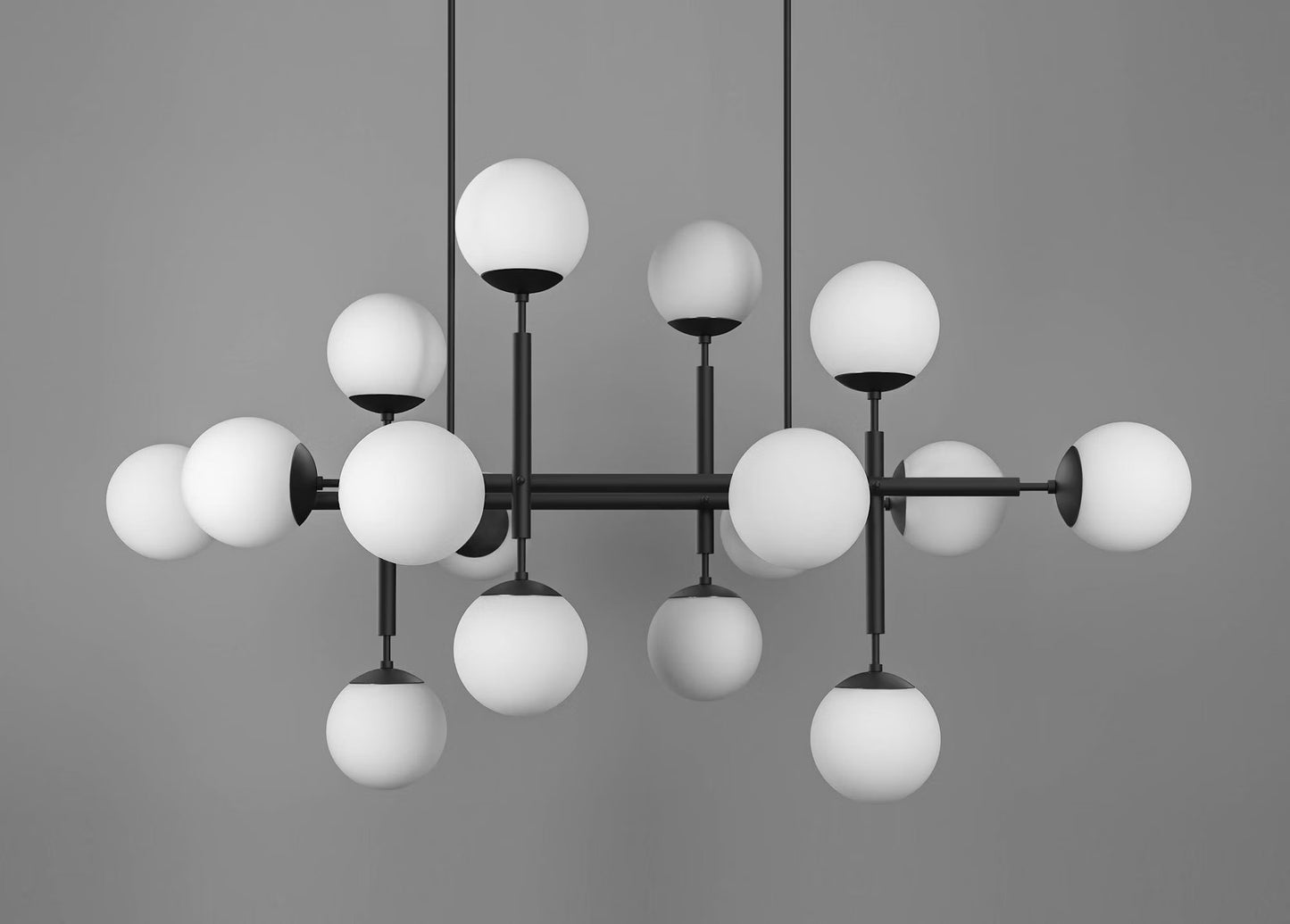 Sleek chandelier with opal matte glass globes and black gunmetal frame.