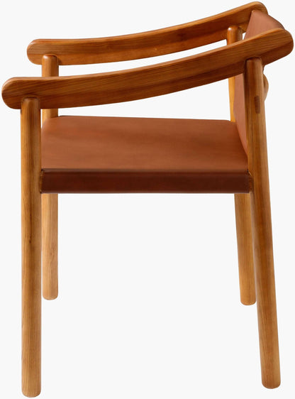 Profile view of the Raymond Dining Chair highlighting the sleek design and premium materials.