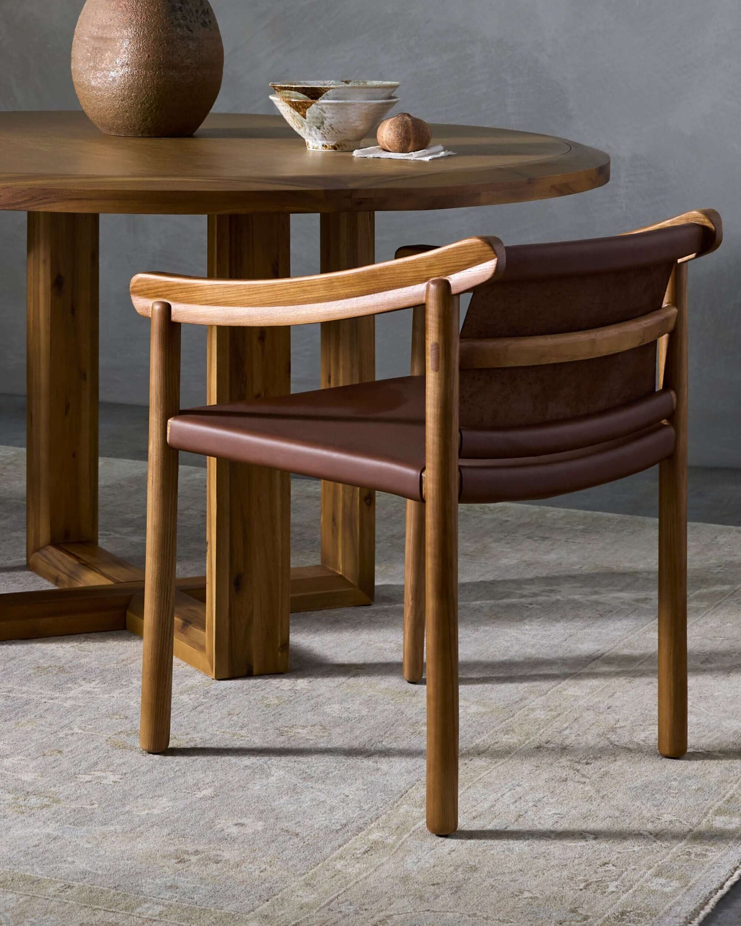 Stylish setting of the Raymond Dining Chair with the Northbank Round Dining Table, enhancing a modern dining room.