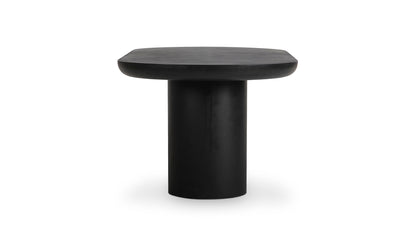 Side profile of the Rocca black concrete dining table, emphasizing its contemporary oval design.