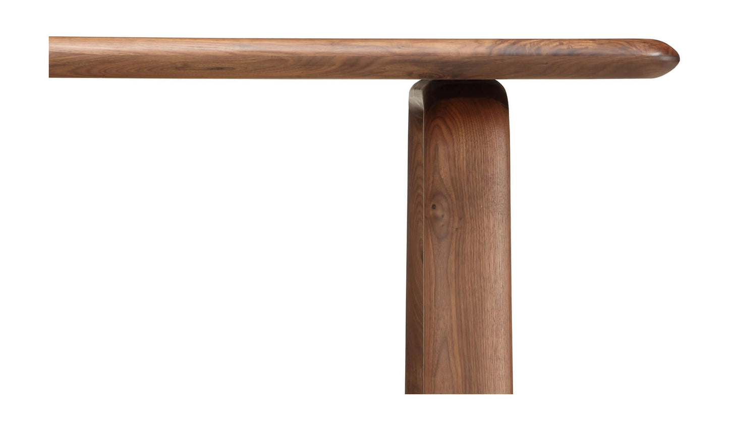 Detailed shot of the side edge and leg of a walnut dining table 