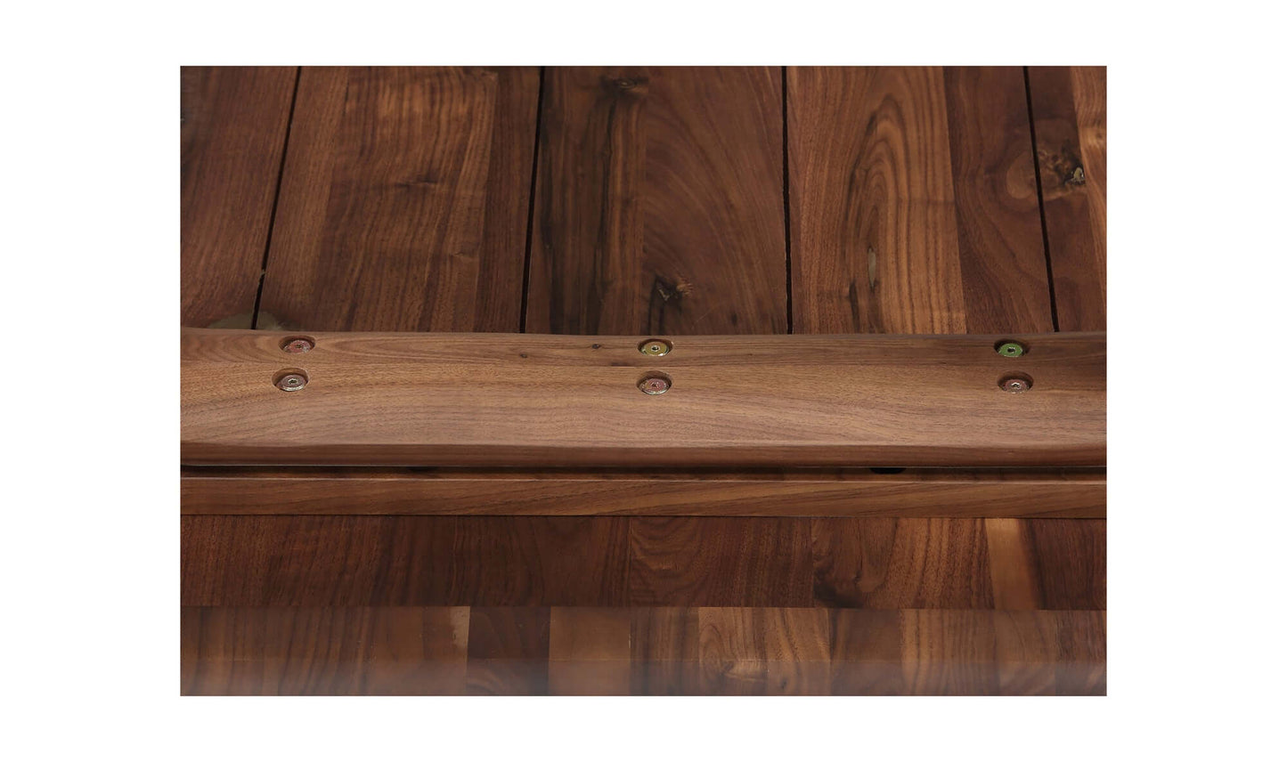 Close-up of the bottom side of a walnut dining table