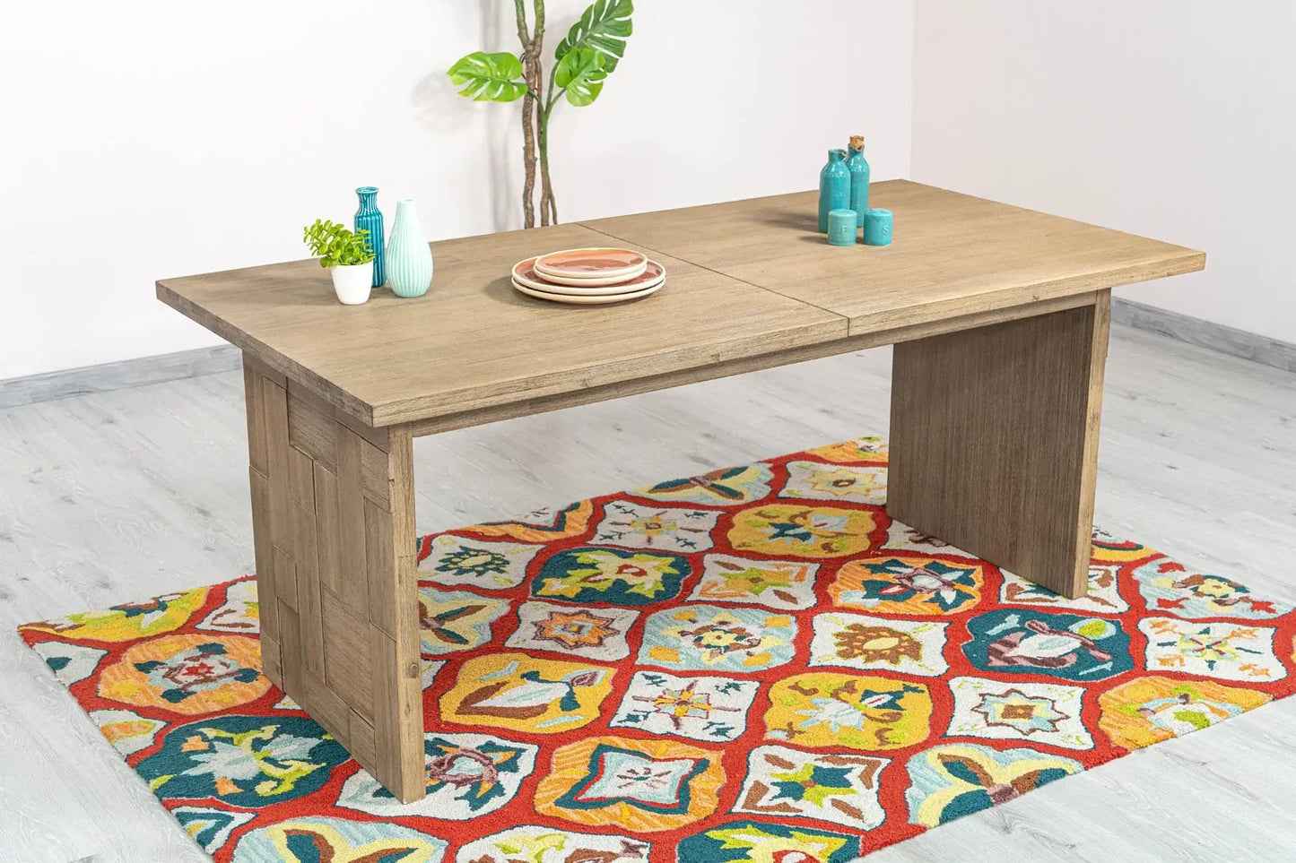 Side view of Atlantis extendable dining table highlighting detailed wood pattern and craftsmanship.