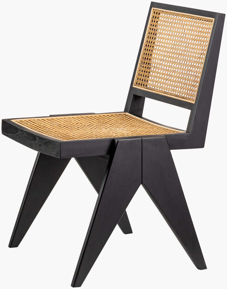 Side view of the Hague Dining Chair with a black wooden frame and rattan seat, highlighting the chair's elegant profile.