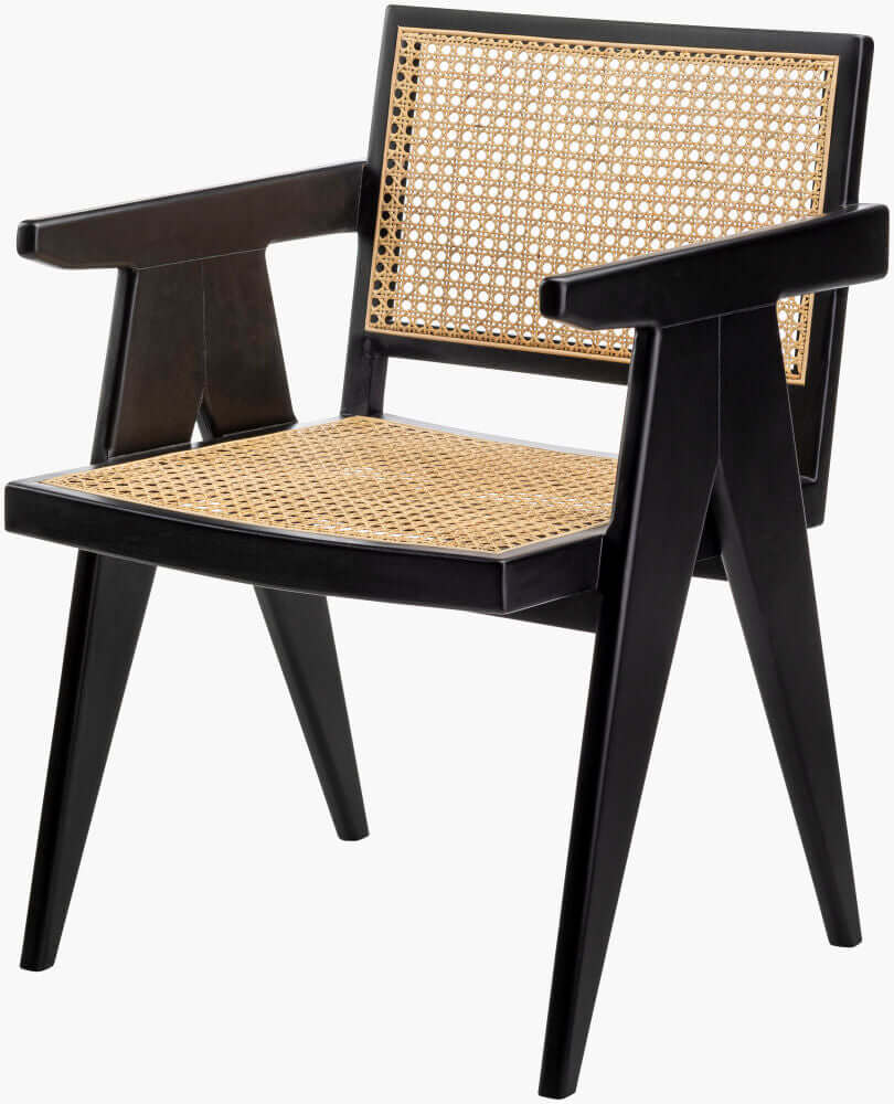 Single Surya Hague Dining Arm Chair with black frame and rattan seat and backrest, viewed from an angle.