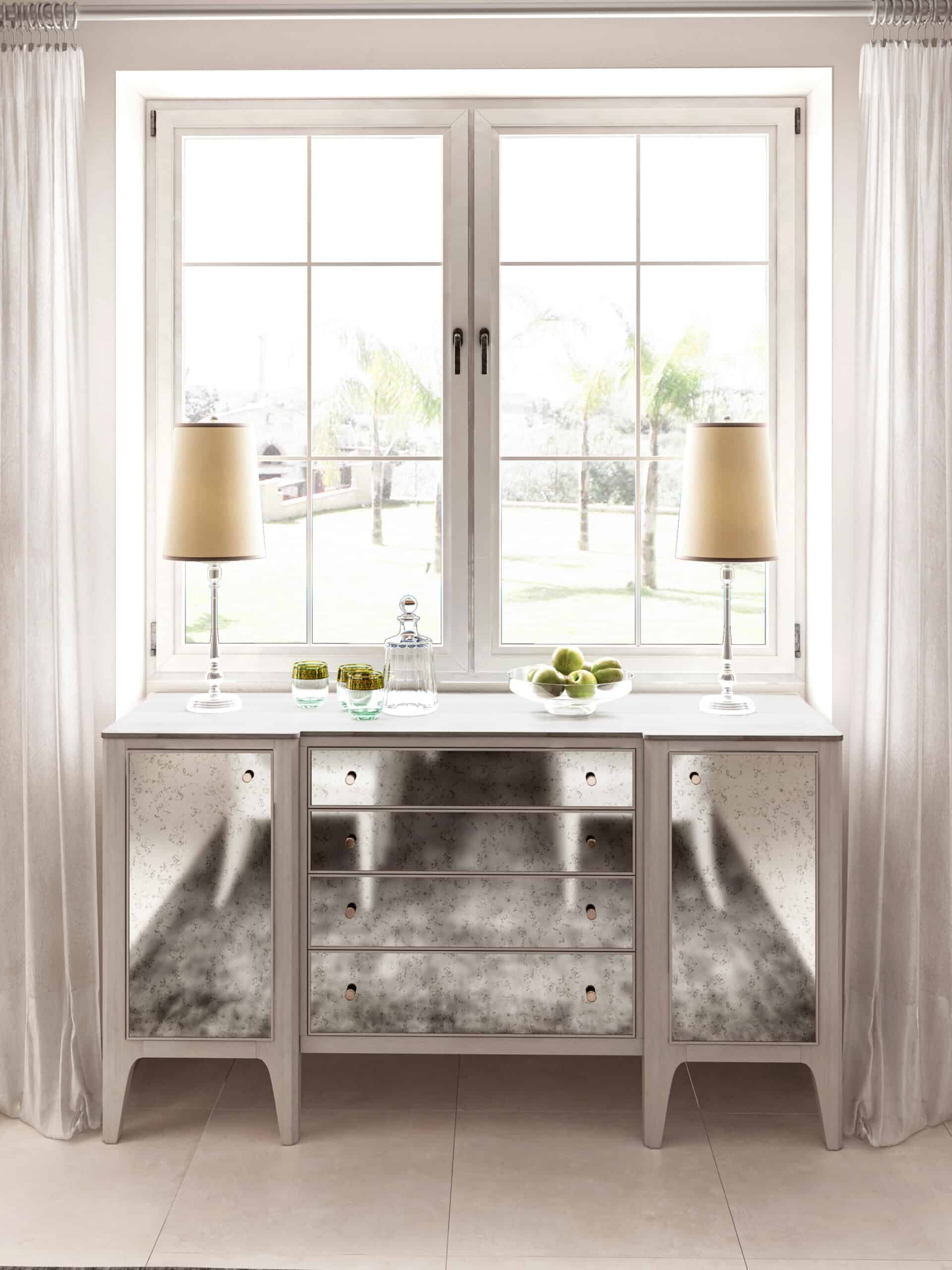 Transitional grey buffet with antique mirror front and storage, set in a well-lit dining room.