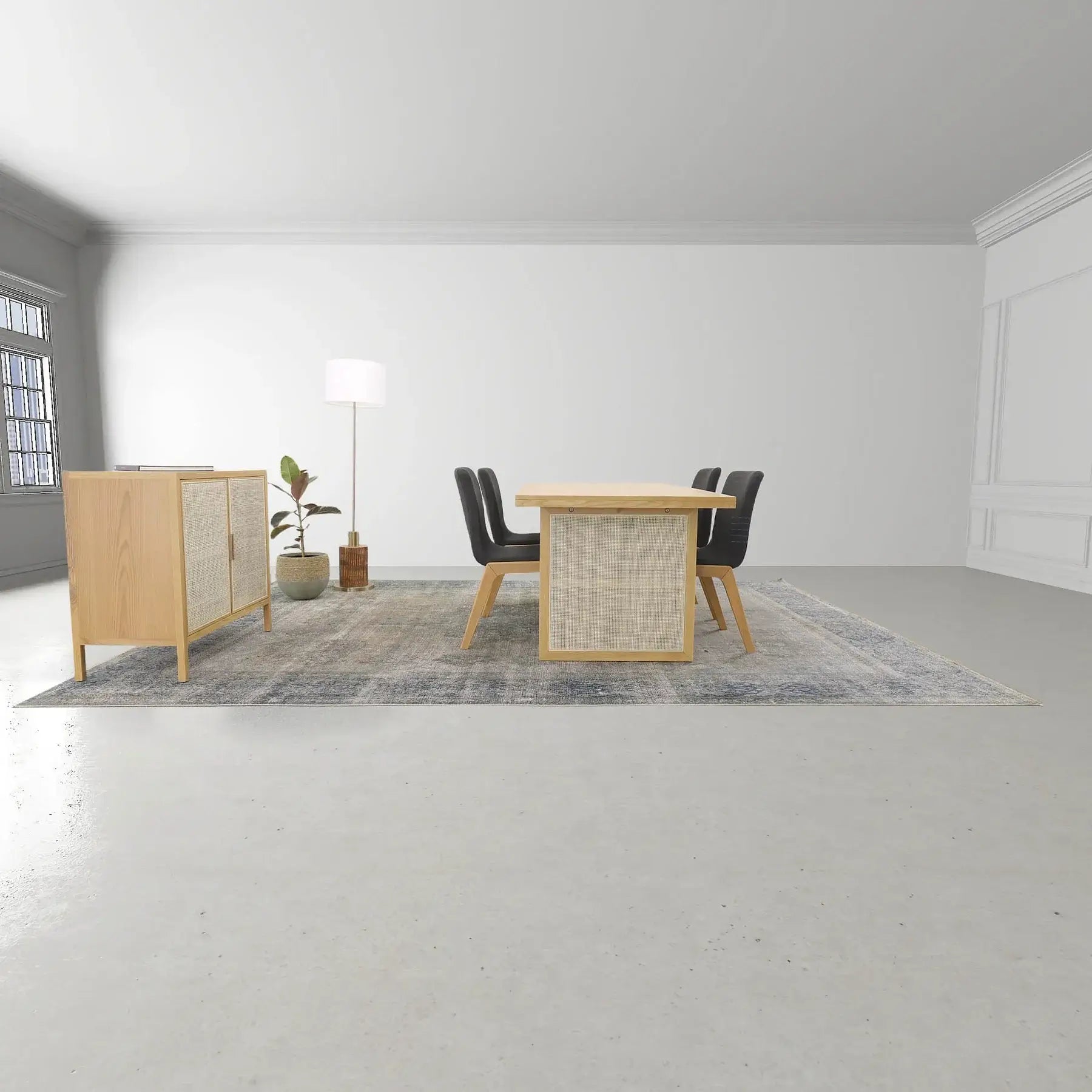 Wicker dining table in a modern dining room setting, paired with black chairs and a matching sideboard.